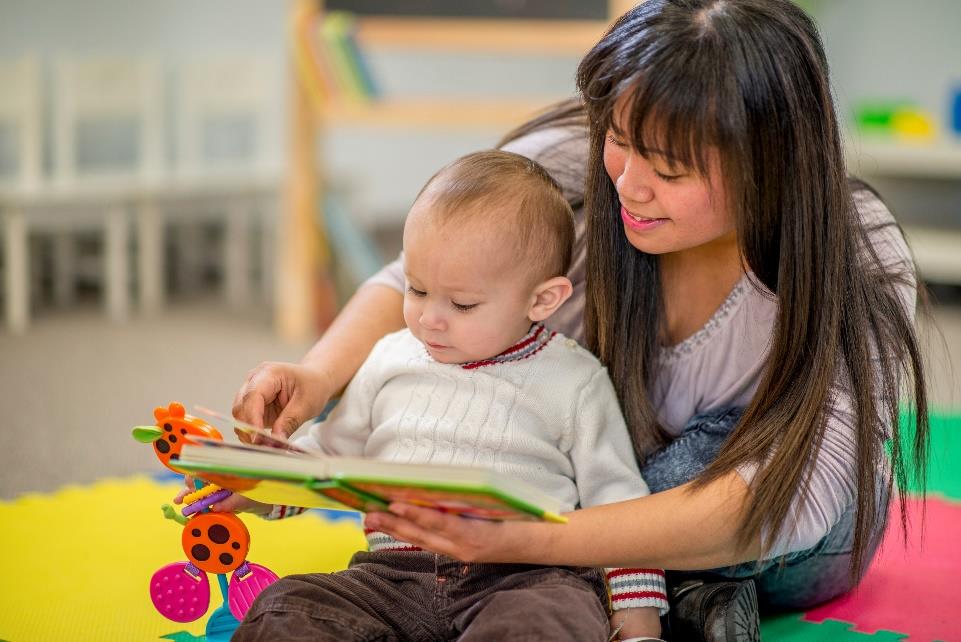 Woman reading to an infant