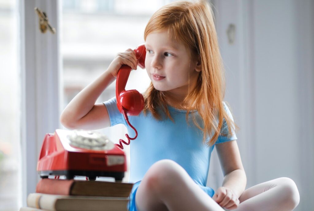 Child talking on phone.
